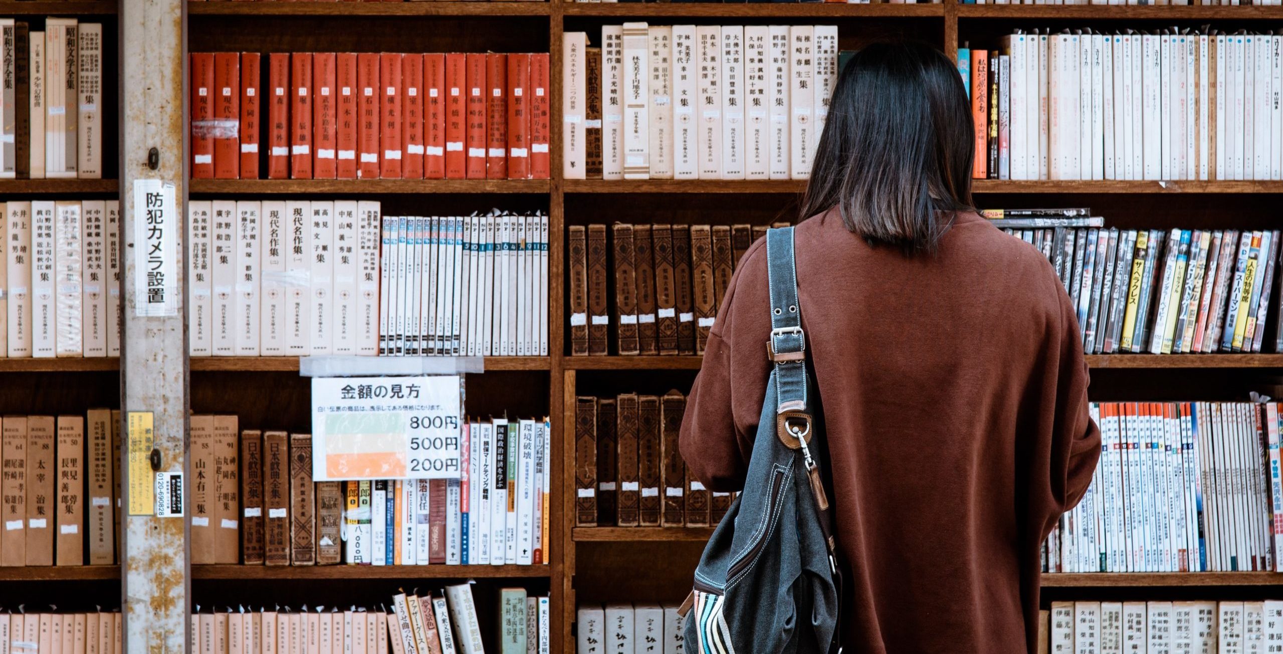 Woman Standing in a Library