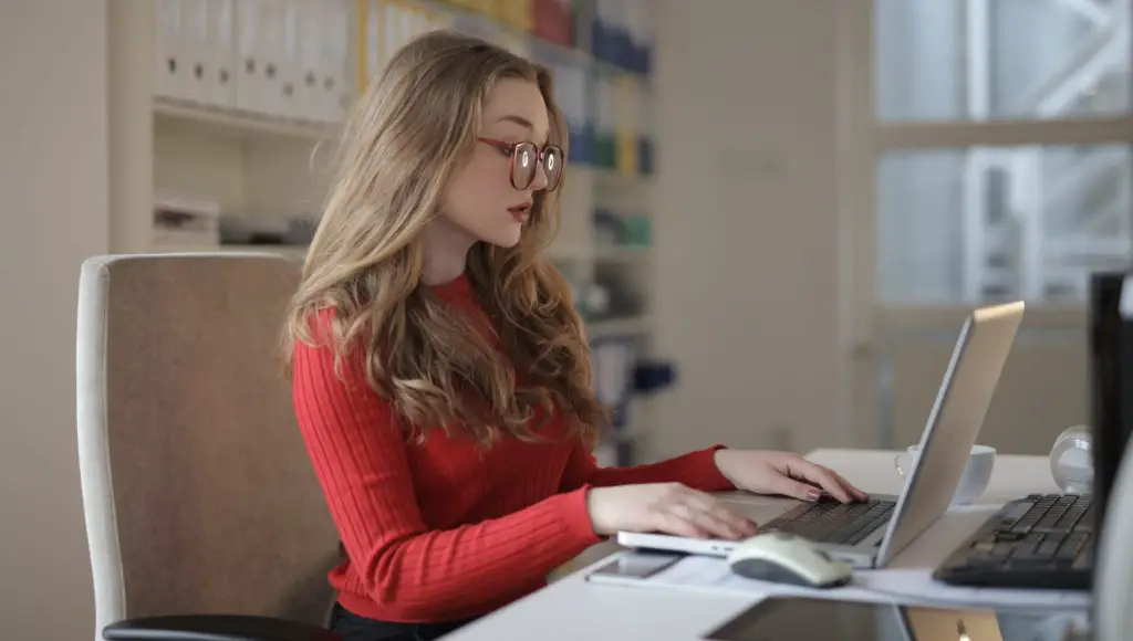 Focused woman working using laptop