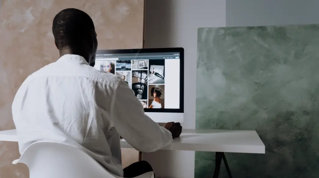 Man browsing pexels on an imac