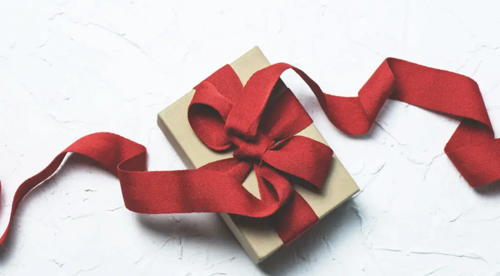 Red and white gift box with ribbon bow