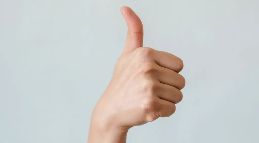 A person doing the thumbs up sign