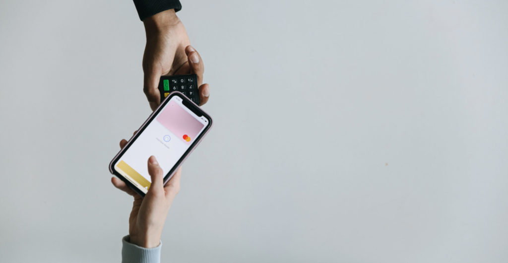 A person paying using a smartphone